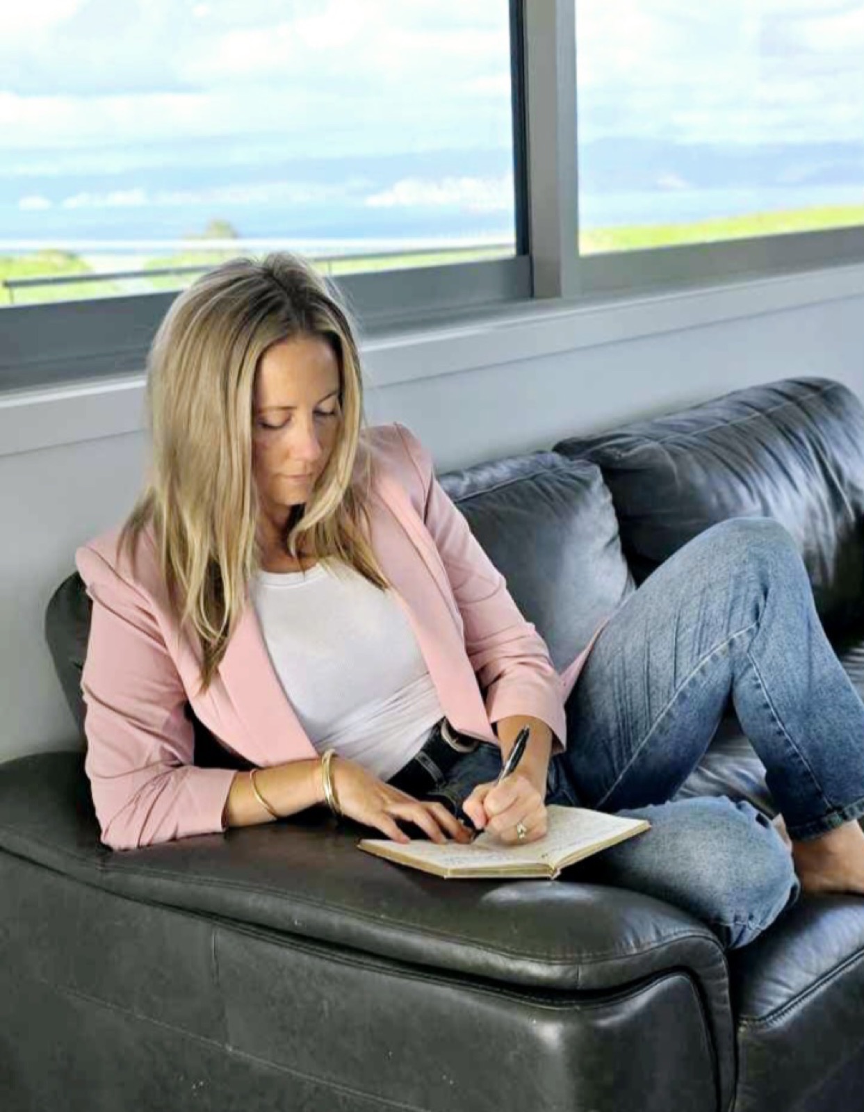 Sarah planning in her notebook at home